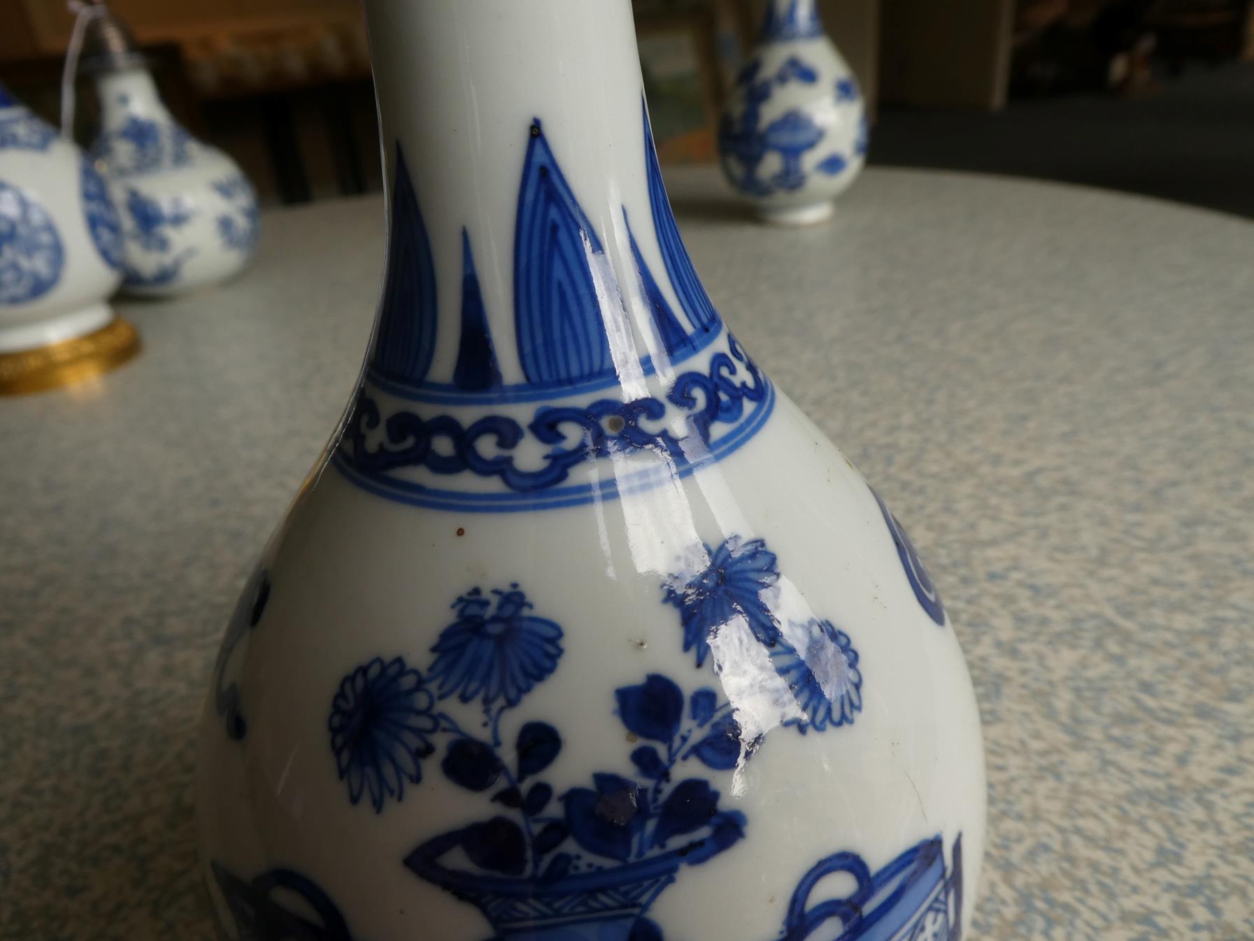 A Pair of Chinese Porcelain Bottle Vases, Kangxi, painted in underglaze blue with scrolls and - Image 25 of 33