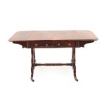 A George IV Mahogany Sofa Table, early 19th century, the rectangular hinged top above two real and