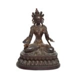 A Copper Alloy Figure of Tara, Nepal, 18th/19th century, sitting cross-legged on a lotus base,