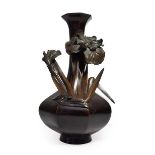 A Japanese Bronze Vase, Meiji period, of octagonal baluster form, cast and applied in relief with