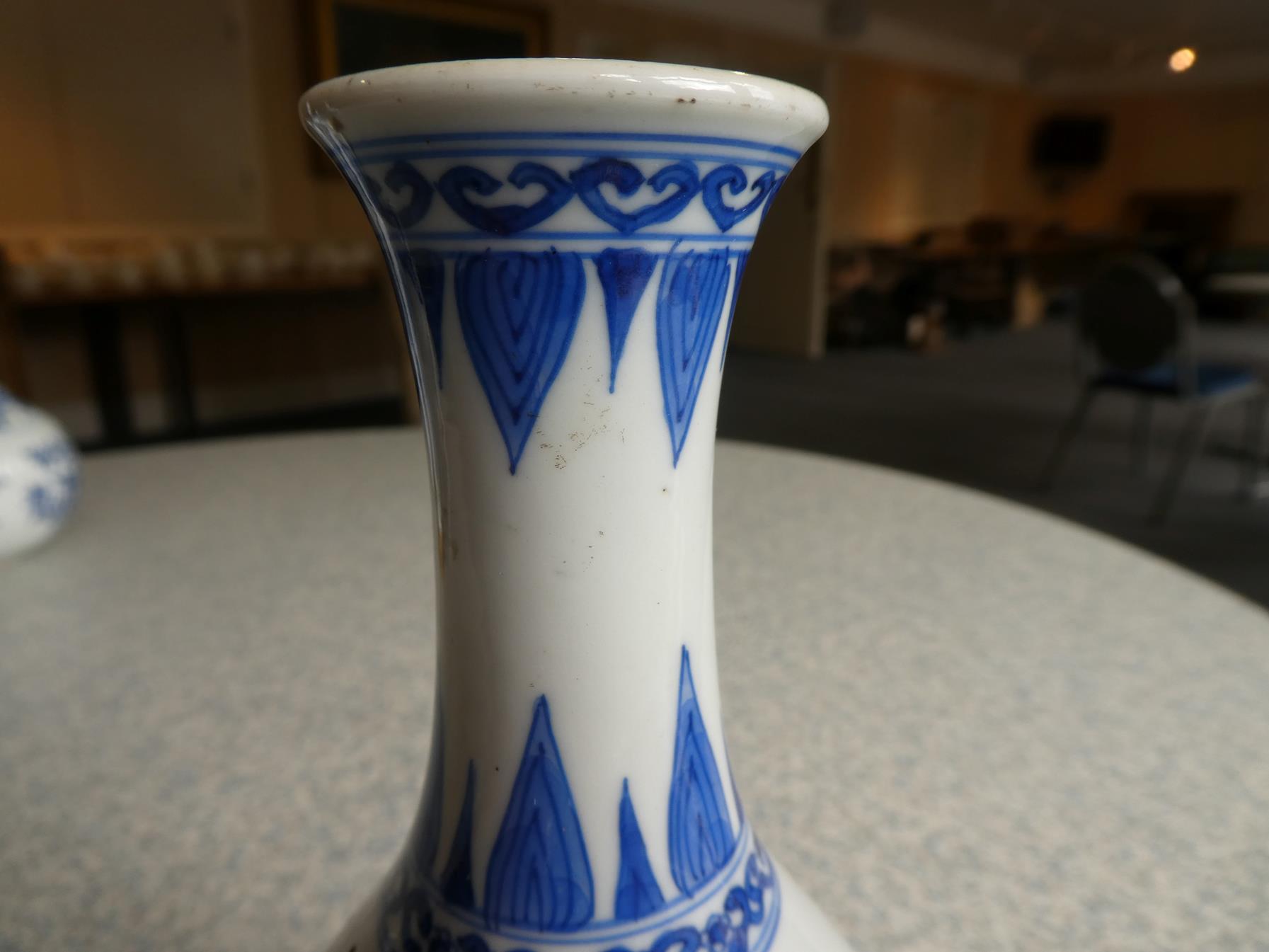 A Pair of Chinese Porcelain Bottle Vases, Kangxi, painted in underglaze blue with scrolls and - Image 10 of 33