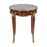 A Louis XV/Transitional Style Mahogany and Gilt Metal Mounted Gueridon, the serpentine shaped purple