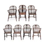 A Harlequin Set of Seven Windsor Armchairs, comprising three matched yewwood examples with pierced