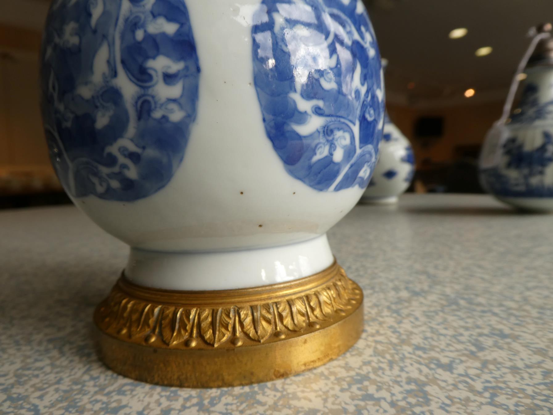 A Gilt Metal Mounted Chinese Porcelain Bottle Vase, the porcelain Kangxi, painted in underglaze blue - Image 14 of 15