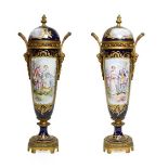 A Pair of Gilt Metal Mounted Sèvres Style Porcelain Vases and Covers, circa 1900, of slender