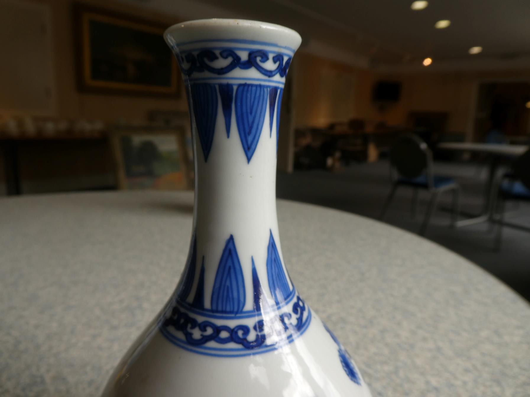 A Pair of Chinese Porcelain Bottle Vases, Kangxi, painted in underglaze blue with scrolls and - Image 26 of 33