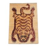 Nepali/Tibetan Tiger Rug, modern The tiger depicted in semi naturalistic pelt form on a plain