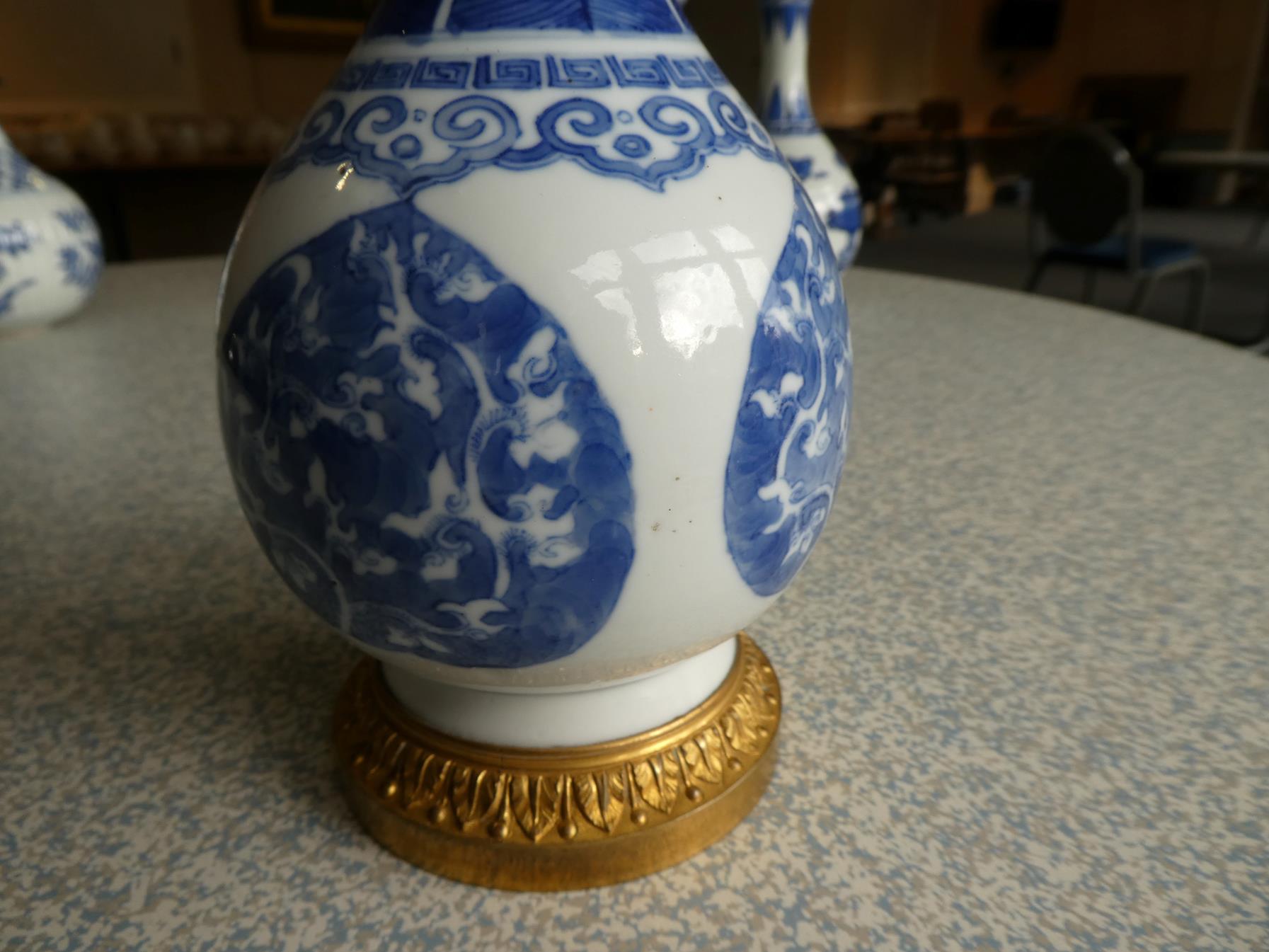 A Gilt Metal Mounted Chinese Porcelain Bottle Vase, the porcelain Kangxi, painted in underglaze blue - Image 3 of 15