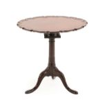 A George III Mahogany Fliptop Tripod Table, late 18th century, the circular moulded pie-crust top