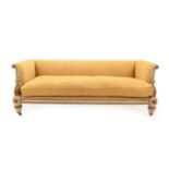 A Cream and Parcel Gilt Sofa, in the manner of William Kent, covered in yellow fabric, with padded
