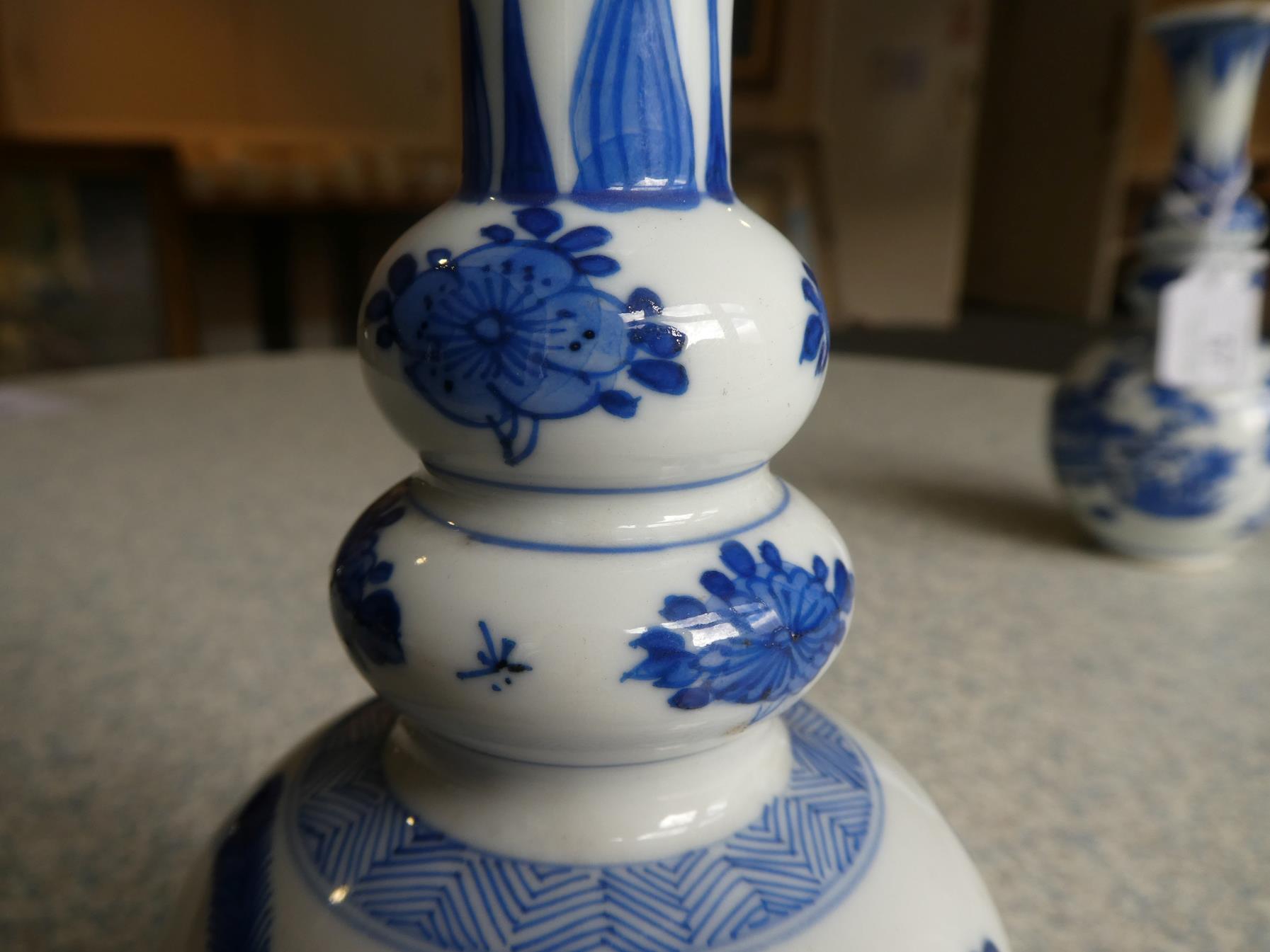 A Matched Pair of Chinese Porcelain Double Gourd Vases, Kangxi, with trumpet necks, painted in - Image 22 of 31