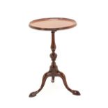 A George III Mahogany Tripod Table, late 18th century, the circular dished top above a vasiform