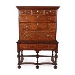 A Late 17th Century Oak and Feather-Banded Chest on Stand, the bold cornice above three short and