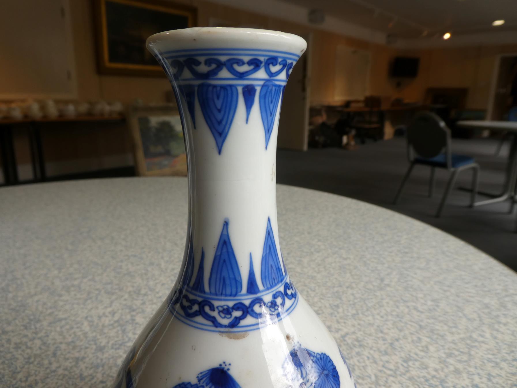 A Pair of Chinese Porcelain Bottle Vases, Kangxi, painted in underglaze blue with scrolls and - Image 8 of 33