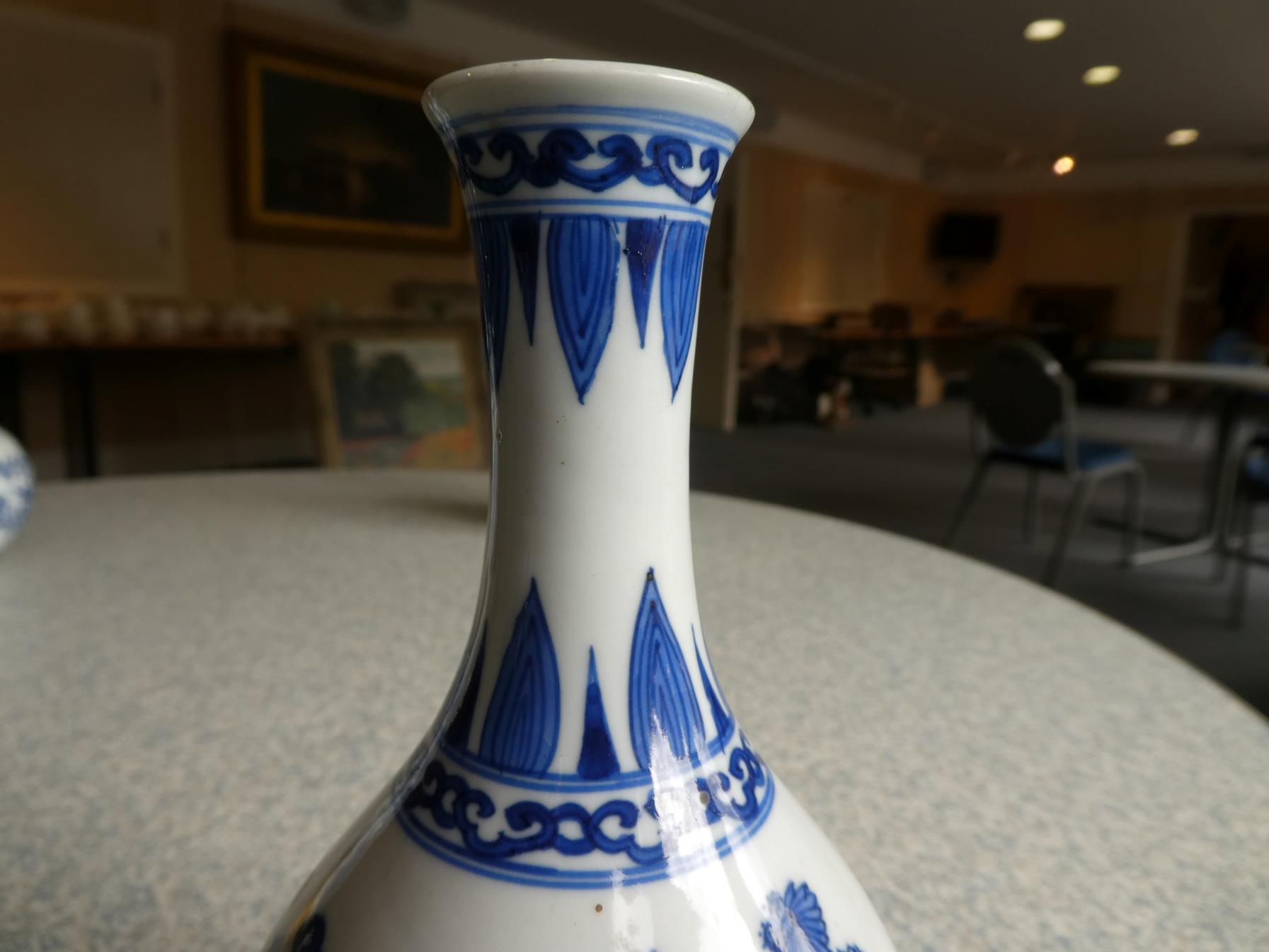 A Pair of Chinese Porcelain Bottle Vases, Kangxi, painted in underglaze blue with scrolls and - Image 27 of 33