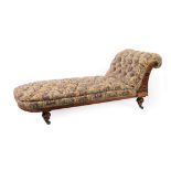 An Aesthetic Walnut and Ebonised Day Bed, late 19th century, recovered in button floral fabric, with