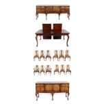 An Early 20th Century Fifteen Piece Walnut Dining Room Suite, comprising an extending dining table