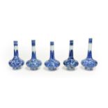 A Matched Garniture of Five Chinese Porcelain Bottle Vases, Kangxi, painted in underglaze blue