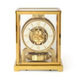 A Brass Atmos Clock, signed Jaeger LeCoultre, 20th century, case with glazed panels, base with