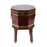 A George III Mahogany and Brass Bound Octagonal Wine Cooler, late 18th century, the hinged lid