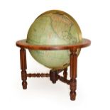 A Crutchley's 12'' Terrestrial Globe, circa 1865, with covered engraved gores, calibrated brass