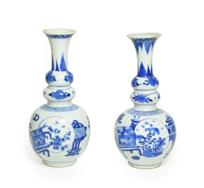 A Matched Pair of Chinese Porcelain Double Gourd Vases, Kangxi, with trumpet necks, painted in