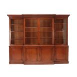 A Victorian Mahogany Library Bookcase, mid 19th century, the cavetto cornice above four glazed doors