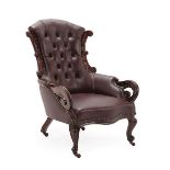 A Victorian Carved Mahogany Armchair, circa 1870, recovered in dark red buttoned leather, the