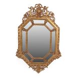 A Victorian Gilt and Gesso Lozenge Shaped Marginal Mirror, circa 1870, the central bevelled glass