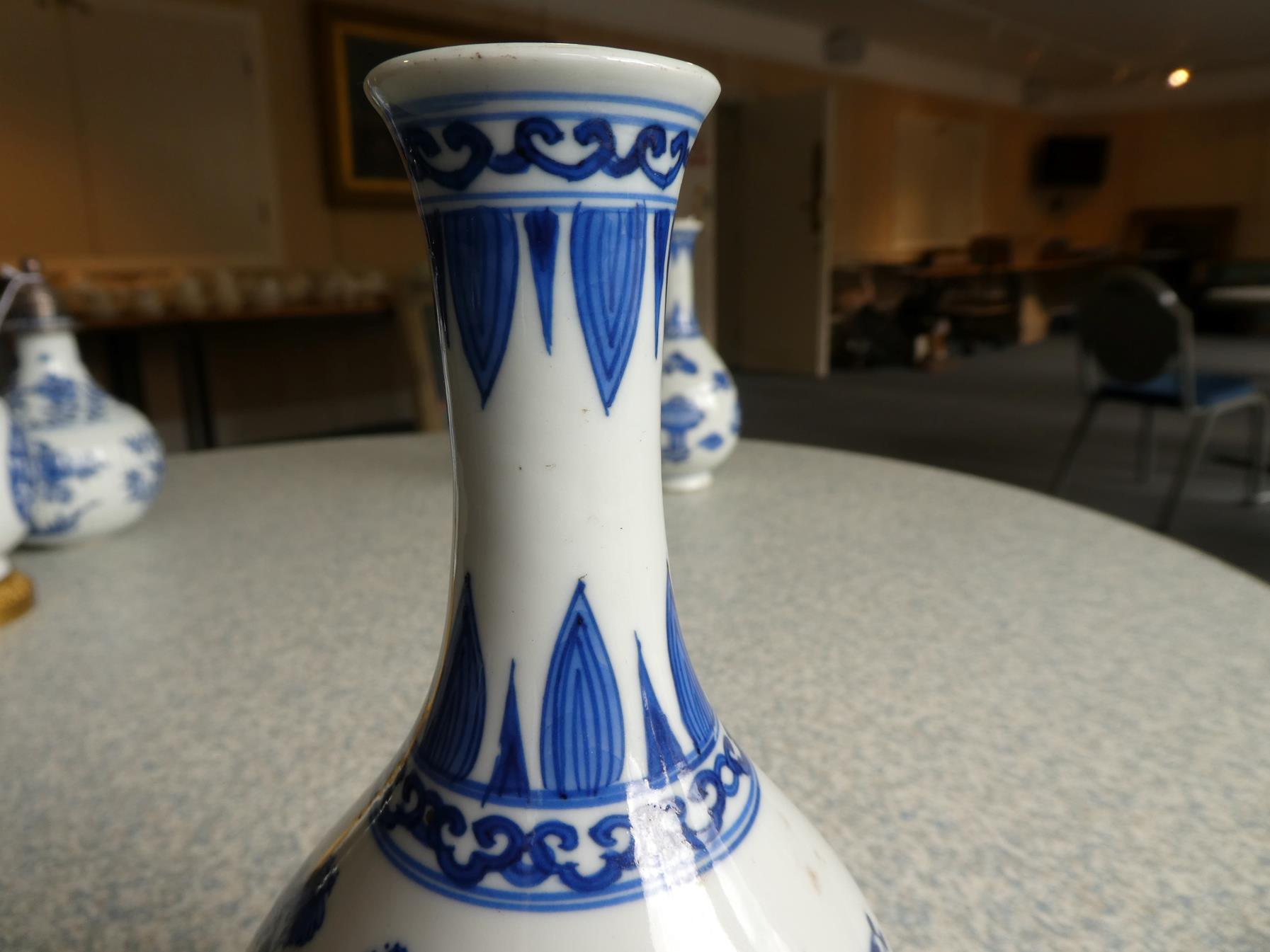 A Pair of Chinese Porcelain Bottle Vases, Kangxi, painted in underglaze blue with scrolls and - Image 28 of 33