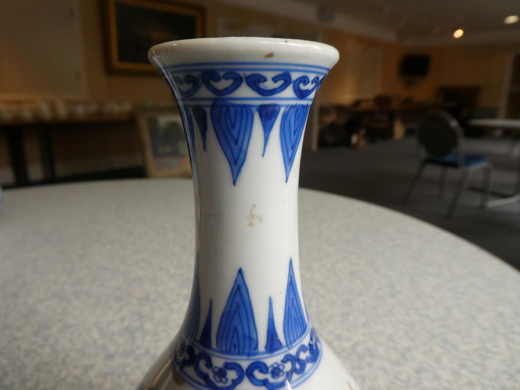 A Pair of Chinese Porcelain Bottle Vases, Kangxi, painted in underglaze blue with scrolls and - Image 9 of 33