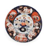 An Imari Porcelain Charger, late 17th century, typically painted with a jardiniere of flowers on a