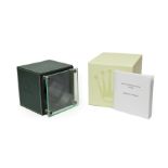 A Rolex Watch Winder, circa 2010, cube shaped winder with a hinged perspex door, single on/off