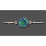 A Black Opal and Diamond Bar Brooch, the circular black opal in a yellow double claw setting,