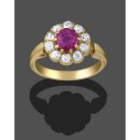 A Pink Sapphire and Diamond Cluster Ring, the round cut pink sapphire within a border of old cut