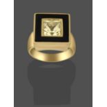 A Yellow Sapphire and Onyx Ring, the princess cut yellow sapphire to a square onyx border, in yellow