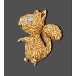 An 18 Carat Gold Ruby and Diamond Brooch, by Kutchinsky, stylised in the form of a squirrel, the eye