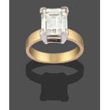 An 18 Carat Gold Diamond Solitaire Ring, the step cut diamond in a white four claw setting, to a