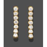 A Pair of 18 Carat Gold Diamond Drop Earrings, seven articulated round brilliant cut diamonds in