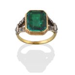 A Georgian Emerald and Diamond Ring, the emerald-cut emerald in a yellow millegrain setting, to