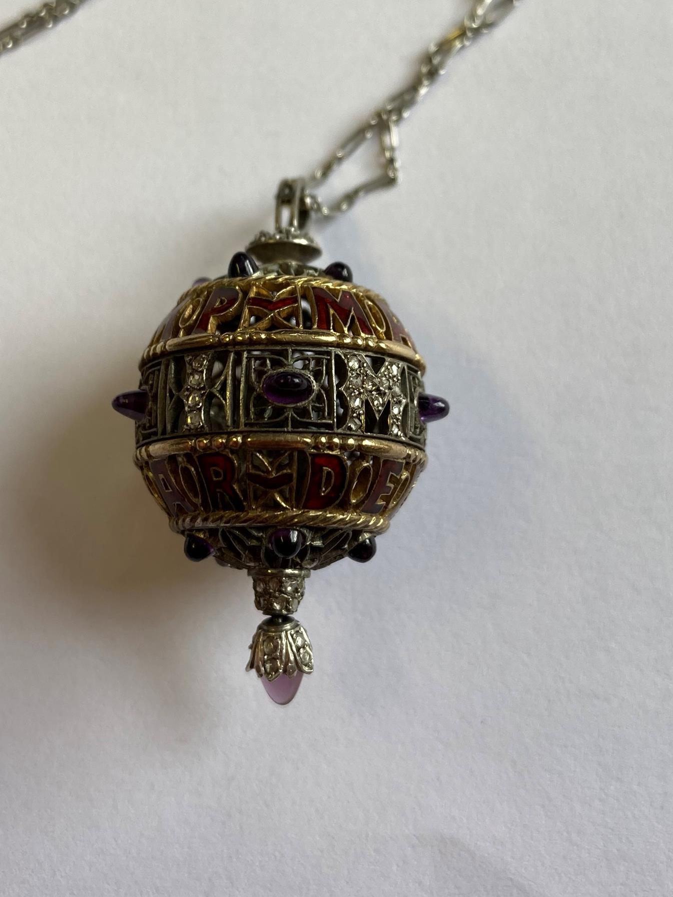 An Amethyst, Diamond and Enamel Pendant on Chain, 1911, the openwork ball with red enamel - Image 6 of 8