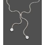 A Platinum Diamond Negligée Necklace, the foxtail link chain gathered by a round brilliant cut