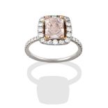 A Diamond Cluster Ring, the central fancy light brownish-pink emerald-cut diamond, in yellow claw