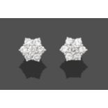 A Pair of Diamond Cluster Earrings, the clusters formed of seven round brilliant cut diamonds, in