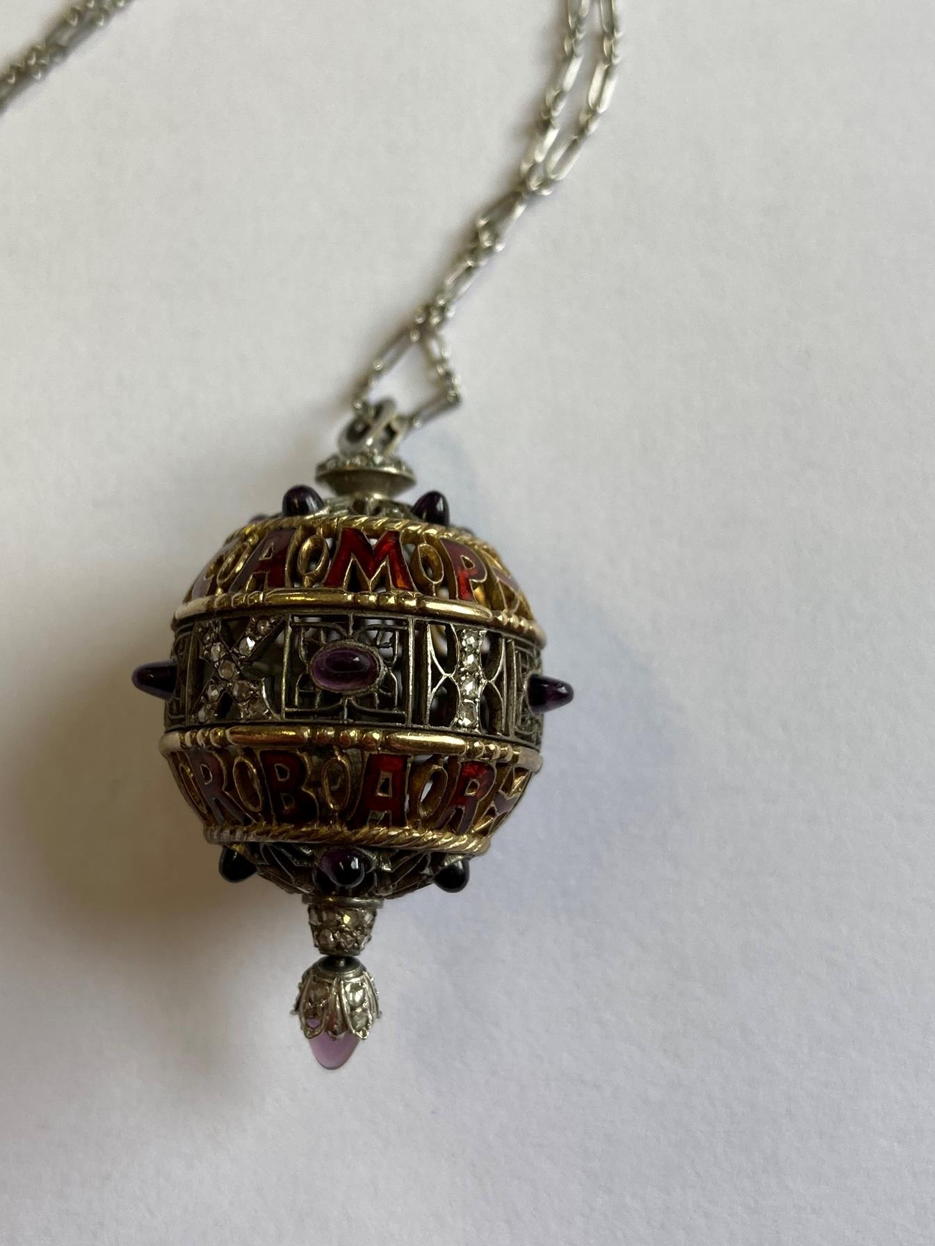 An Amethyst, Diamond and Enamel Pendant on Chain, 1911, the openwork ball with red enamel - Image 5 of 8