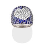 A Contemporary Sapphire and Diamond Ring, the central heart shaped motif set throughout with round