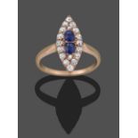 A Sapphire and Diamond Navette Ring, two oval cut sapphires within a border of rose cut and old