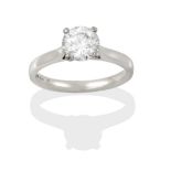 A Platinum Diamond Solitaire Ring, the round brilliant cut diamond in a four claw setting, on a