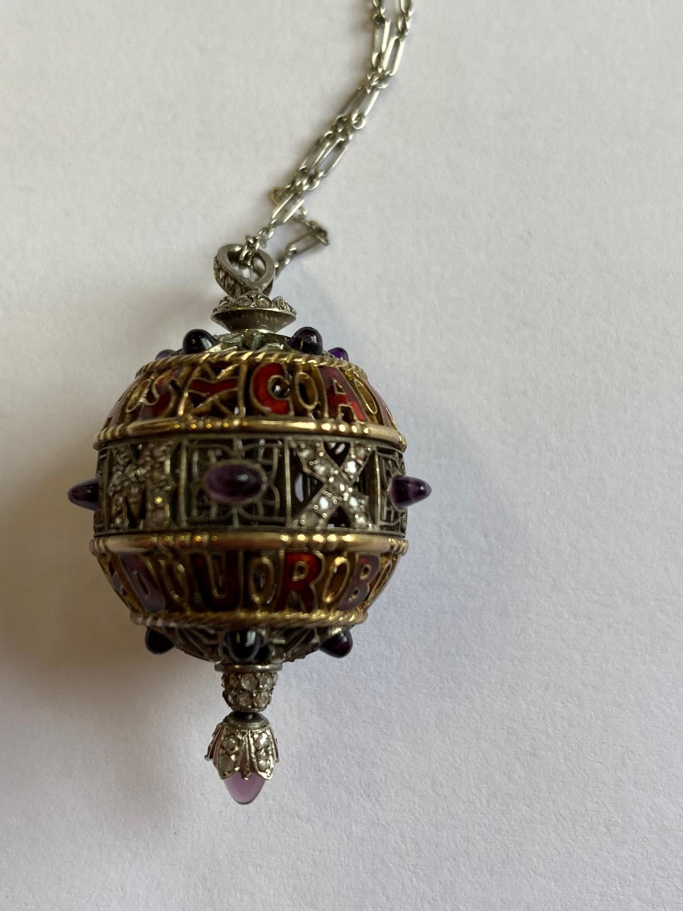 An Amethyst, Diamond and Enamel Pendant on Chain, 1911, the openwork ball with red enamel - Image 4 of 8
