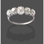 A Diamond Five Stone Ring, the graduated old cut diamonds in white claw settings, to a tapered